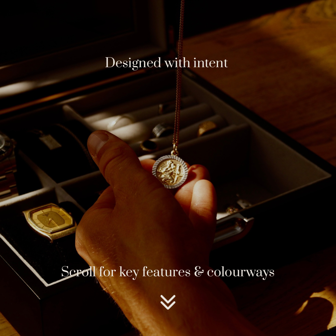 Close-up lifestyle image of the LDN IV men’s 4-slot black watch box by Transform, shown open as a man removes a necklace and holds it in his hand. Text overlay reads ‘Designed with intent’ and underneath ‘Scroll for key features and colourways.