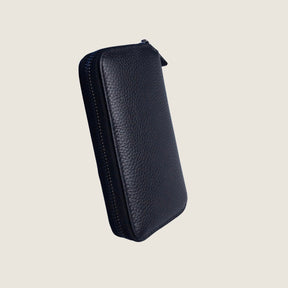 The back of a compact black leather jewellery case with blank background.