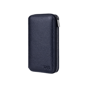 Compact jewellery travel case in navy leather with no background.