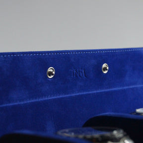 Close up of the suede interior of the leather watch roll holding 3 watches.
