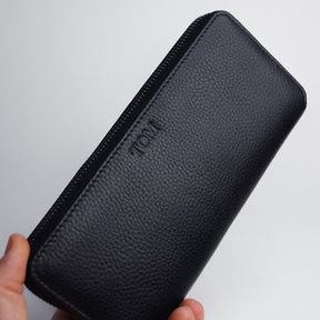 Hand holding a personalised large leather jewellery case.