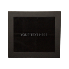 Bird’s-eye view of the LDN IV men’s 4-slot watch and jewellery box by Transform with the lid closed, showing the personalisation option with the words ‘Your text here’ etched onto the glass lid.