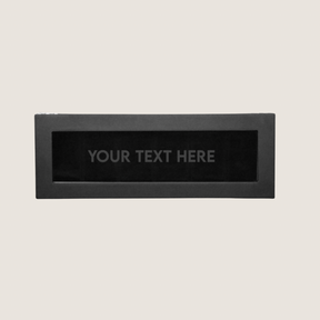 Bird’s-eye view of the LDN VI men’s 6-slot black watch box by Transform with the lid closed, showing the personalisation option with the words ‘Your text here’ etched onto the glass lid.