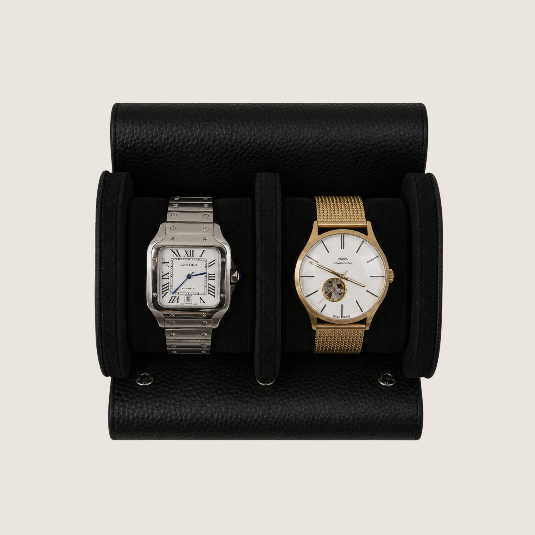 Two wristwatches displayed side-by-side in a black textured leather watch roll.