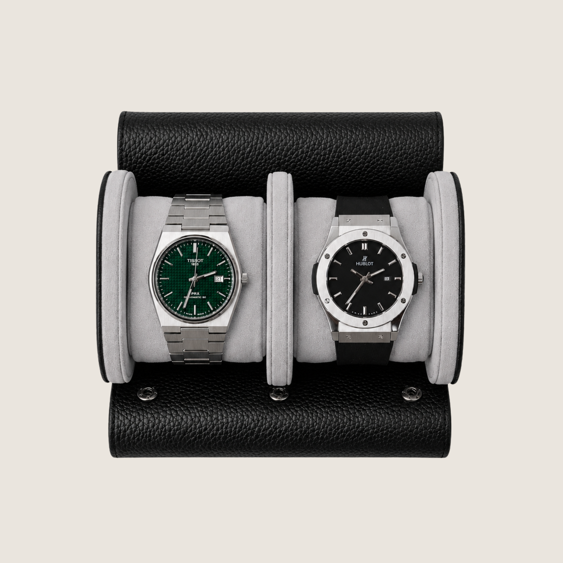 A two-watch wristwatch display stand made of black pebbled leather with light grey suede cushions.